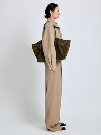 Proenza Schouler Image of model wearing Days Carryall in Perforated Suede in Olive