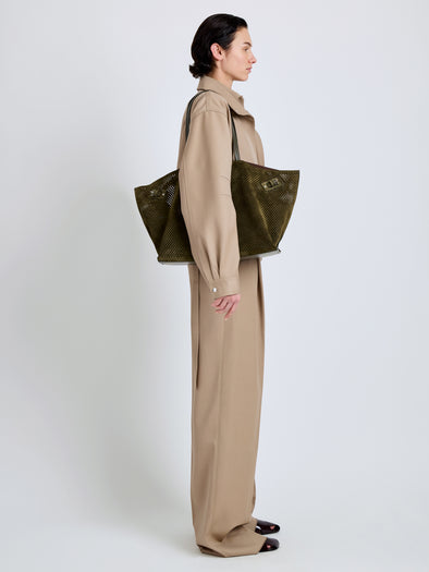 Proenza Schouler Image of model wearing Days Carryall in Perforated Suede in Olive