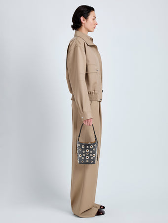 Proenza Schouler Image of model wearing Mini Bucket Bag in Smooth Calf with Grommets in Black