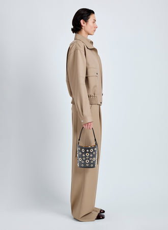 Proenza Schouler Image of model wearing Mini Bucket Bag in Smooth Calf with Grommets in Black