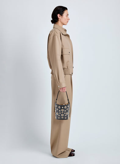 Proenza Schouler Image of model wearing Mini Bucket Bag in Smooth Calf with Grommets in Black