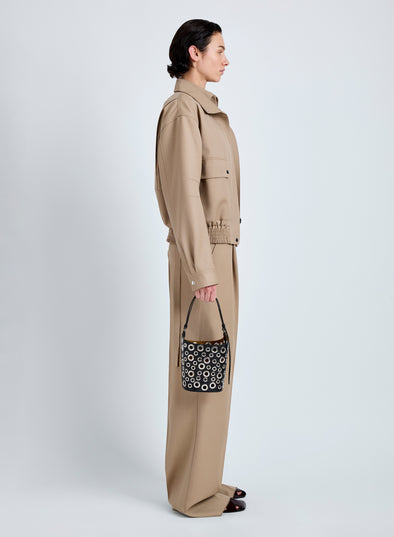 Proenza Schouler Image of model wearing Mini Bucket Bag in Smooth Calf with Grommets in Black