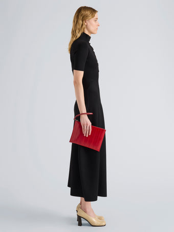 Proenza Schouler Image of model wearing Zip Pouch in Eel in Red