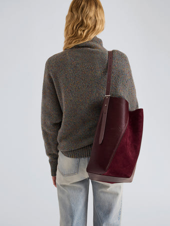 Proenza Schouler Image of model wearing Hex Bucket Bag in Haircalf Combo in Bordeaux