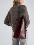 Proenza Schouler Detail Image of Model wearing Hex Bucket Bag in Haircalf Combo in Bordeaux