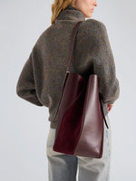 Proenza Schouler Detail Image of Model wearing Hex Bucket Bag in Haircalf Combo in Bordeaux