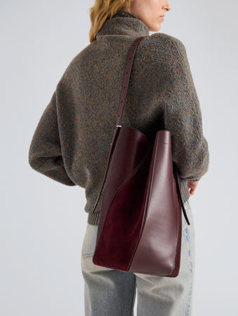 Proenza Schouler Detail Image of Model wearing Hex Bucket Bag in Haircalf Combo in Bordeaux