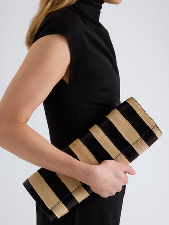 Proenza Schouler Image of model wearing Hex Clutch in Striped Eel in Black Ivory