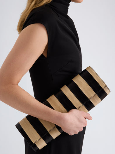 Proenza Schouler Image of model wearing Hex Clutch in Striped Eel in Black Ivory
