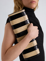 Proenza Schouler Image of model wearing Hex Clutch in Striped Eel in Black Ivory