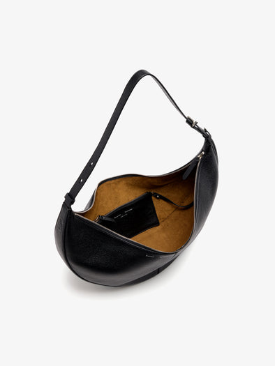 Proenza Schouler Still Life Aerial Image of Hobo Slide Bag in Pebbled Calf in black