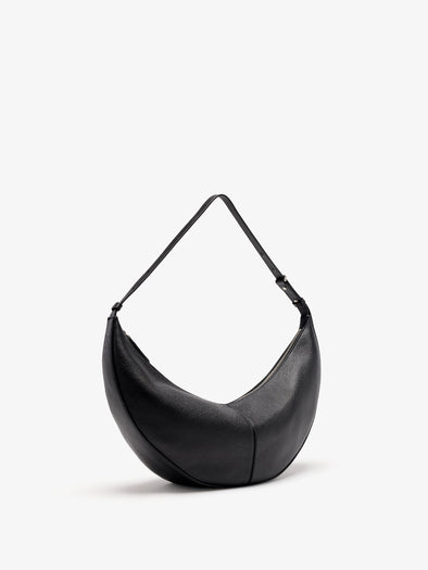 Proenza Schouler Still Life 3/4 Image of Hobo Slide Bag in Pebbled Calf in black