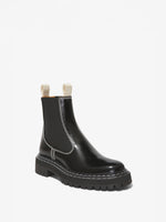 Proenza Schouler front 3/4 image of Lug Sole Chelsea Boots in black