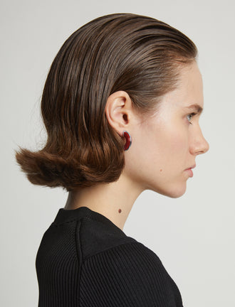 Proenza Schouler Image of model wearing mini hoop earrings in red