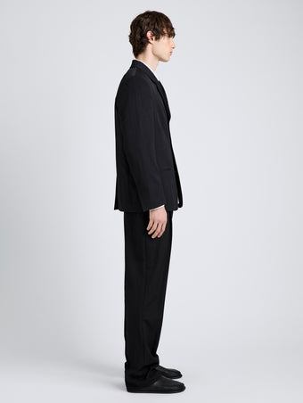 Proenza Schouler Side full length image of model wearing James Jacket in Wool Suiting in Black
