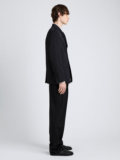 Proenza Schouler Side full length image of model wearing James Jacket in Wool Suiting in Black