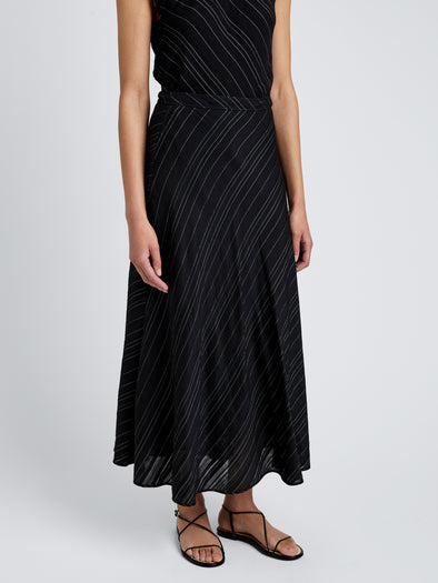 Proenza Schouler detail image of model wearing Kaia Skirt in Woven Stripe Flou in black/chalk
