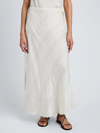 Proenza Schouler detail image of model wearing Kaia Skirt in Woven Stripe Flou in chalk/black
