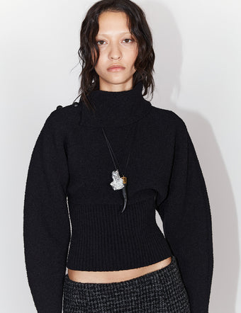 Cropped image of model in Wool Viscose Boucle Top in black with horn pendant in black and rock necklace in silver
