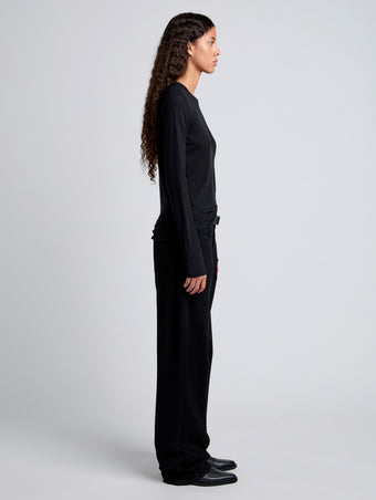 Side image of model wearing Solid Tissue Jersey Long Sleeve Tee in Black