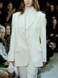 Cropped image of model walking Proenza Schouler FW24 Runway show wearing Archer Jacket and Teddy Pant in Wool Twill Suiting in wax