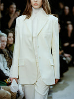 Cropped image of model walking Proenza Schouler FW24 Runway show wearing Archer Jacket and Teddy Pant in Wool Twill Suiting in wax