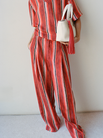 Proenza Schouler Front crop image of model wearing Amira Pant in Printed Silk Habotai in Vermillion Multi