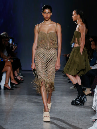 model wearing khaki top and skirt