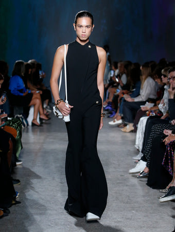 model wearing black jumpsuit