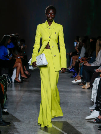 model wearing yellow blazer and pant