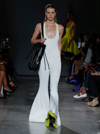 model wearing white jumpsuit