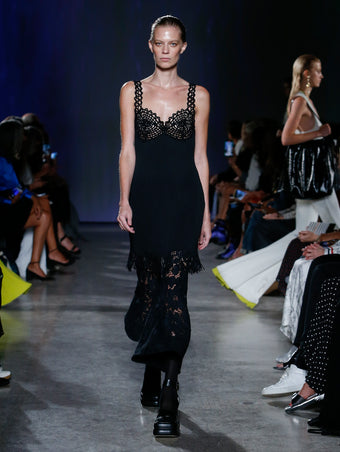 model wearing black lace top and pants