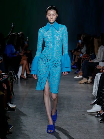 model wearing turquoise lace dress