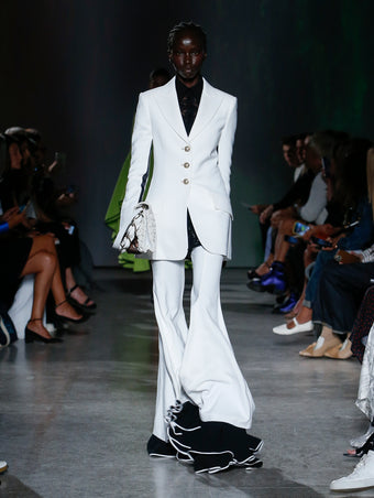 model wearing white suit