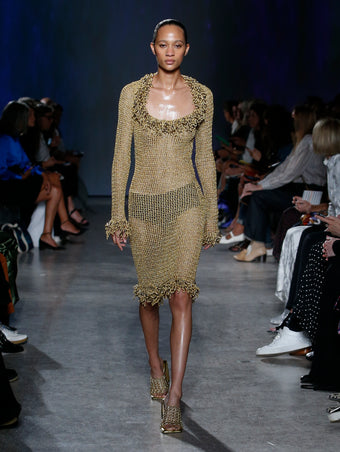 Selena Forrest wearing gold crochet dress