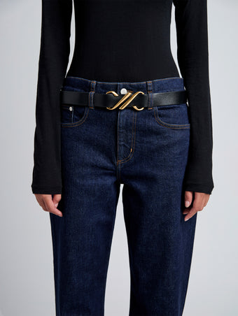 Image of model wearing Monogram Belt in Shiny Calf in black
