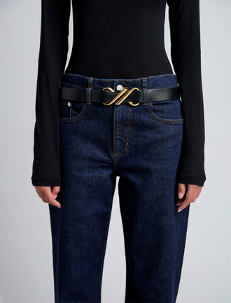 Image of model wearing Monogram Belt in Shiny Calf in black