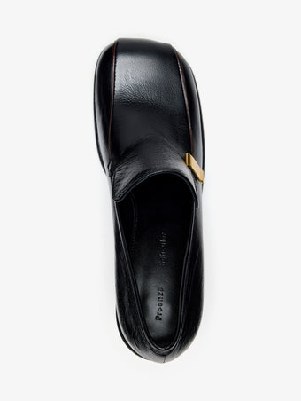 Proenza Schouler Aerial Still Life Image of Esme Loafer in Nappa Latex in Black