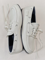Aerial image of Deck Shoes in Nappa in Ecru on tonal beige background.