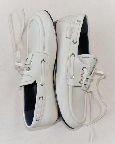 Aerial image of Deck Shoes in Nappa in Ecru on tonal beige background.