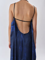 Proenza Schouler Back editorial image of model wearing Wilma Dress in Double Printed Silk Twill in Cobalt Multi with back straps untied. 