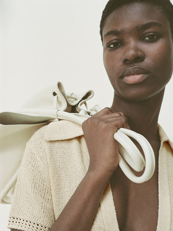 Cropped image of model wearing Auden Dress in Textured Knit in YELLOW