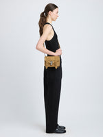 Proenza Schouler image of model wearing PS1 Mini Crossbody Bag in Nubuck Calf in tobacco