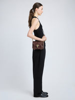 Proenza Schouler image of model wearing PS1 Mini Crossbody Bag in chestnut