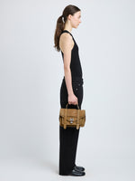 Proenza Schouler image of model wearing PS1 Tiny Bag in Nubuck Calf in tobacco