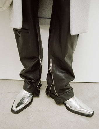 Cropped image of model in Bronco Ankle Boots in Silver Mirrored Metallic