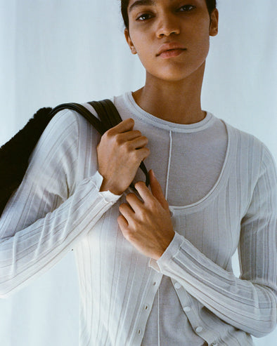 Cropped image of model wearing Hattie Cardigan and Ares Shirt in Lightweight Cashmere in ivory