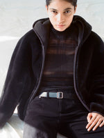 Cropped image of model wearing Dakota Coat in Reversible Suede Shearling in cacao with Stefanie Sweater in Plaid Knits in black