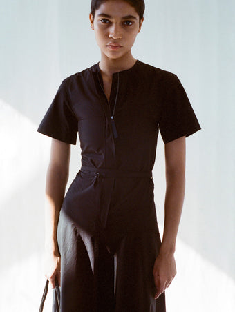Cropped image of model wearing Elizabeth Dress in Parachute Cotton in black