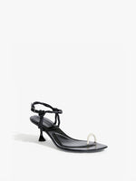 Front 3/4 image of the Tee Toe Ring Sandals in black/cream  Edit alt text